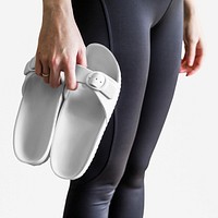 Model psd holding white sandal mockup closeup