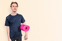 Man in black sport shirt with pink yoga mat