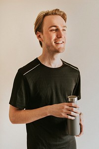 Man in black sport shirt with water bottle