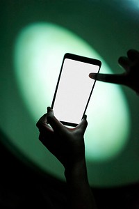 Man holding up a smartphone at the planetarium