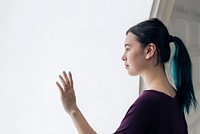 Girl touching a large interactive screen at a futuristic smart home