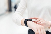 Woman wearing smartwatch technology of the future