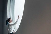 Girl using touch screen in a modern smart home