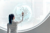 Researcher spinning a globe on a round screen 