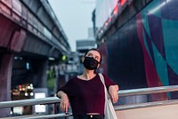 Girl wearing a face mask in the new normal downtown Bangkok