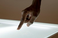 Hand touching transparent presentation screen