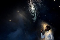 Man experiencing the universe at a planetarium 