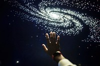 Man experiencing the universe at a planetarium 