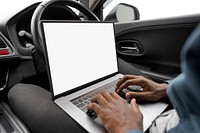 Researcher using a laptop while working on a new self driving car model