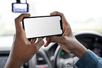 Phone screen mockup driver taking a photo in the car psd