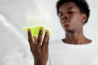 Man looking at a hologram from a yellow screen