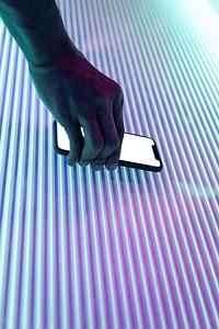 Smart phone on glowing neon lights 