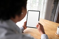 Woman working on a digital tablet in the new normal