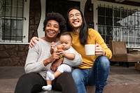 Happy diverse family sitting at the porch during covid19 lockdown