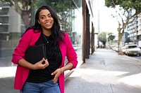 Happy oman in pink blazer stylish business casual look outdoor photoshoot