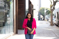 African American oman in pink blazer stylish business casual look 