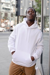 Sporty man hoodie mockup psd white and brown pants in the city apparel shoot