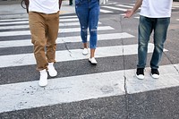 Streetwear apparel jeans men and women crossing road in city