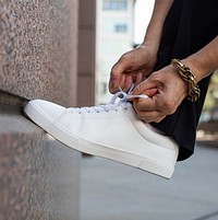 Canvas sneakers mockup white psd model tying shoelaces apparel ad