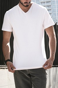 Man wearing casual white t-shirt in the city apparel shoot