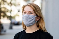 Blonde woman wearing mask psd in the city outdoor photoshoot