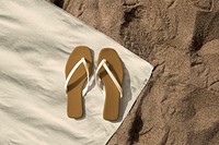 Brown sandals mockup psd on beach towel aerial view
