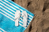 White sandals mockup psd on beach towel aerial view