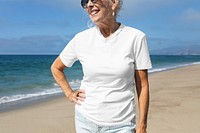 Senior woman in white tee at the beach
