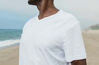 African American man in white tee at the beach close up