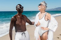 Happy mature couple hanging out at the beach