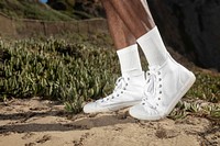 Ankle sneakers mockup psd in white beach fashion shoot