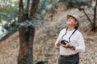 Old man appreciating the beauty of nature