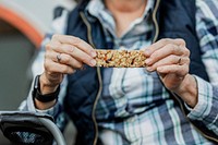 Grandma holding a homemade energy bar 