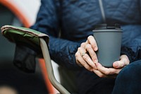 Senior woman holding reusable cup