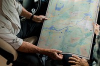 Senior couple searching for direction on a map 