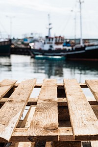 Wooden pallets in a fishing boat harbor