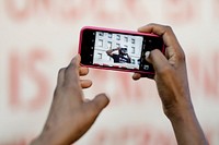 Black using an iPhone at a Black Lives Matter protest outside the Hall of Justice in Downtown Los Angeles. 15 JUL, 2020 - LOS ANGELES, USA