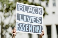 Black lives are essential board at a BLM protest in LA