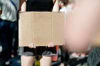 Woman holding a cardboard with copy space at a black lives matter protest 