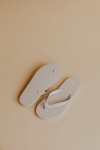 Off white flip flop slipper on beige