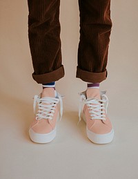Peach sneakers mockup with untied laces on model