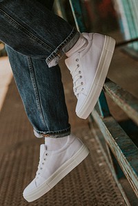White canvas sneakers mockup on jeans model