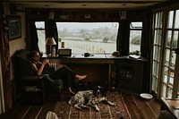 Woman sitting on a couch using smartphone