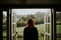 Woman standing in front of the house