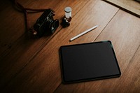 Digital tablet on wooden table