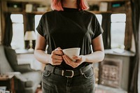 Woman with a coffee cup mockup in a cabin