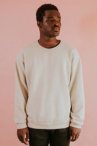 African American man wearing white sweater mockup on pink background