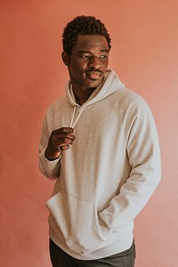 Black man in white hoodie mockup on pink background