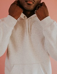 Black man in white hoodie mockup on pink background