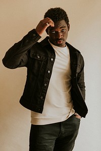 Men's black jeans jacket mockup on African American male model in studio shot